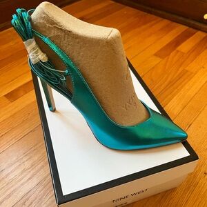 Never worn metallic blue heels.